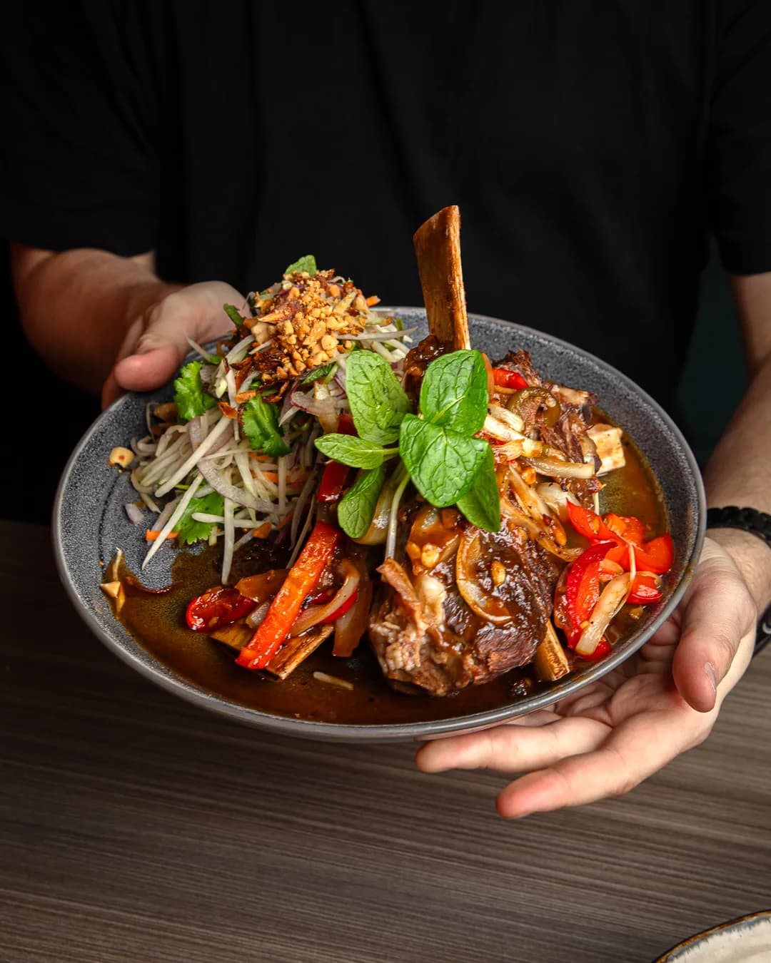 Oven-baked beef ribs in tamarind with green papaya salad