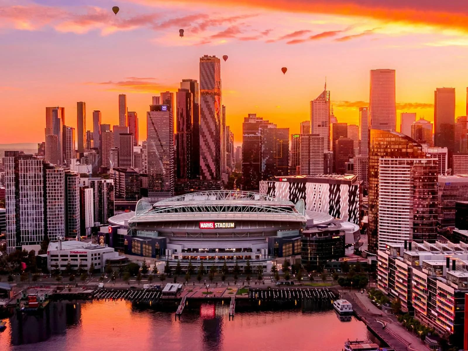 Marvel Stadium and the Docklands waterfront at sunset, a short walk from ĂN ĐI