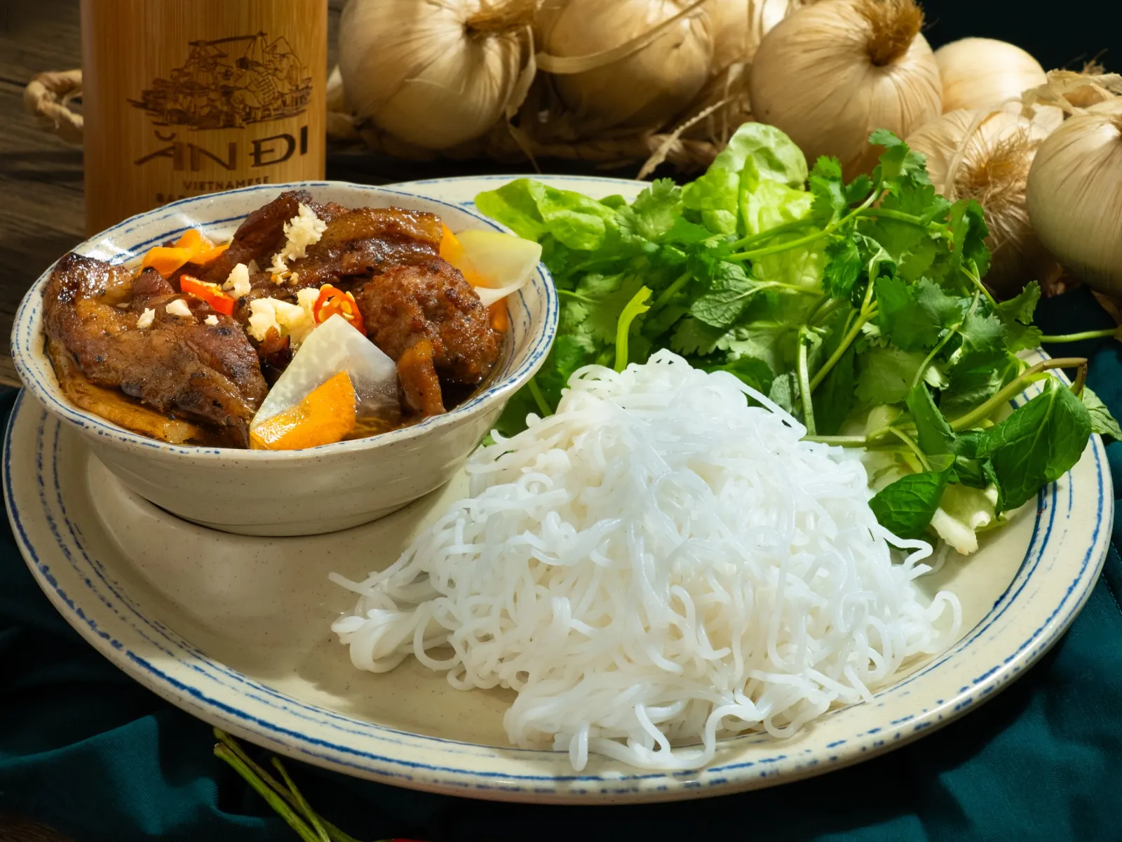 Bún chả Hà Nội with grilled pork in dressing, vermicelli noodles and fresh herbs